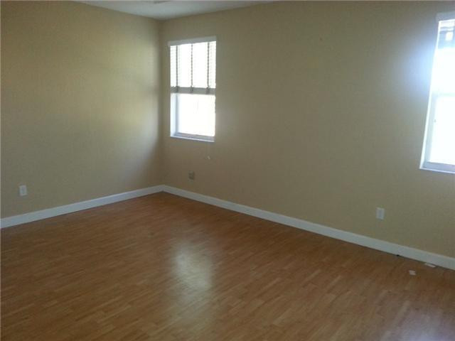 4103 Southwest 159th Avenue, Unit 49 Miramar, FL 33027 - Photo 12 of 20 an empty room with a window