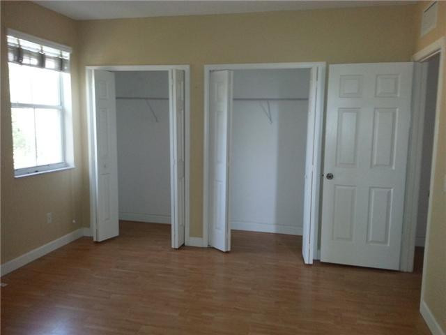 4103 Southwest 159th Avenue, Unit 49 Miramar, FL 33027 - Photo 13 of 20 an empty room with windows and closet