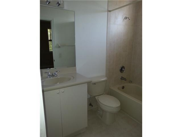 4103 Southwest 159th Avenue, Unit 49 Miramar, FL 33027 - Photo 14 of 20 a bathroom with a sink a toilet and shower