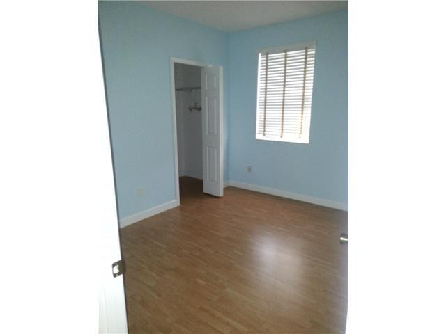 4103 Southwest 159th Avenue, Unit 49 Miramar, FL 33027 - Photo 15 of 20 a view of an empty room with a window