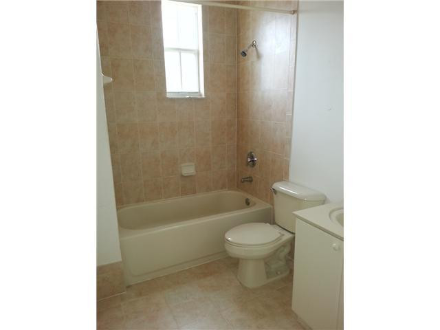 4103 Southwest 159th Avenue, Unit 49 Miramar, FL 33027 - Photo 10 of 20 a bathroom with a sink a toilet and bathtub