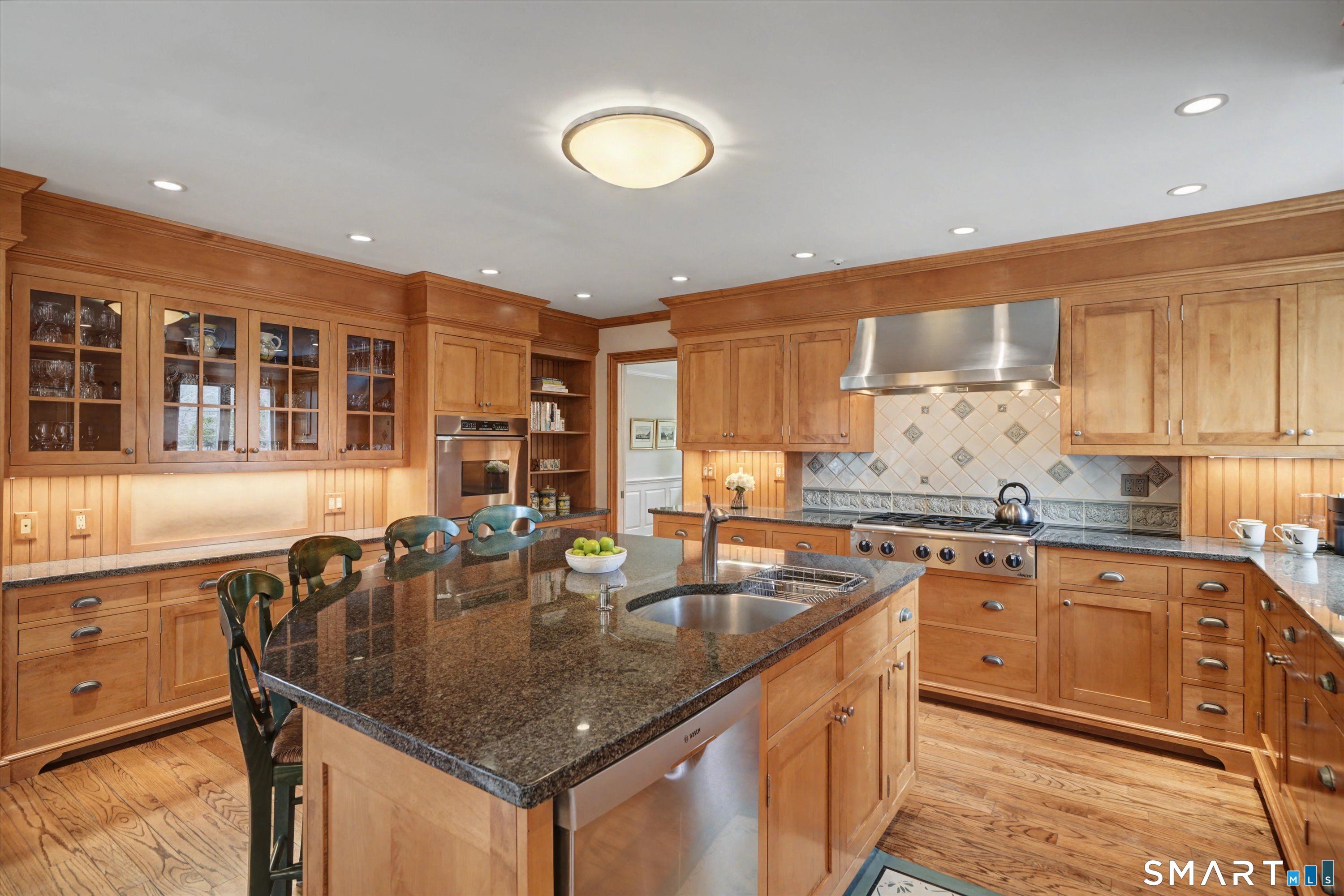 78 Keelers Ridge Road Wilton, CT 06897 - Photo 12 of 40 a kitchen with stainless steel appliances granite countertop a sink a stove and a wooden cabinets