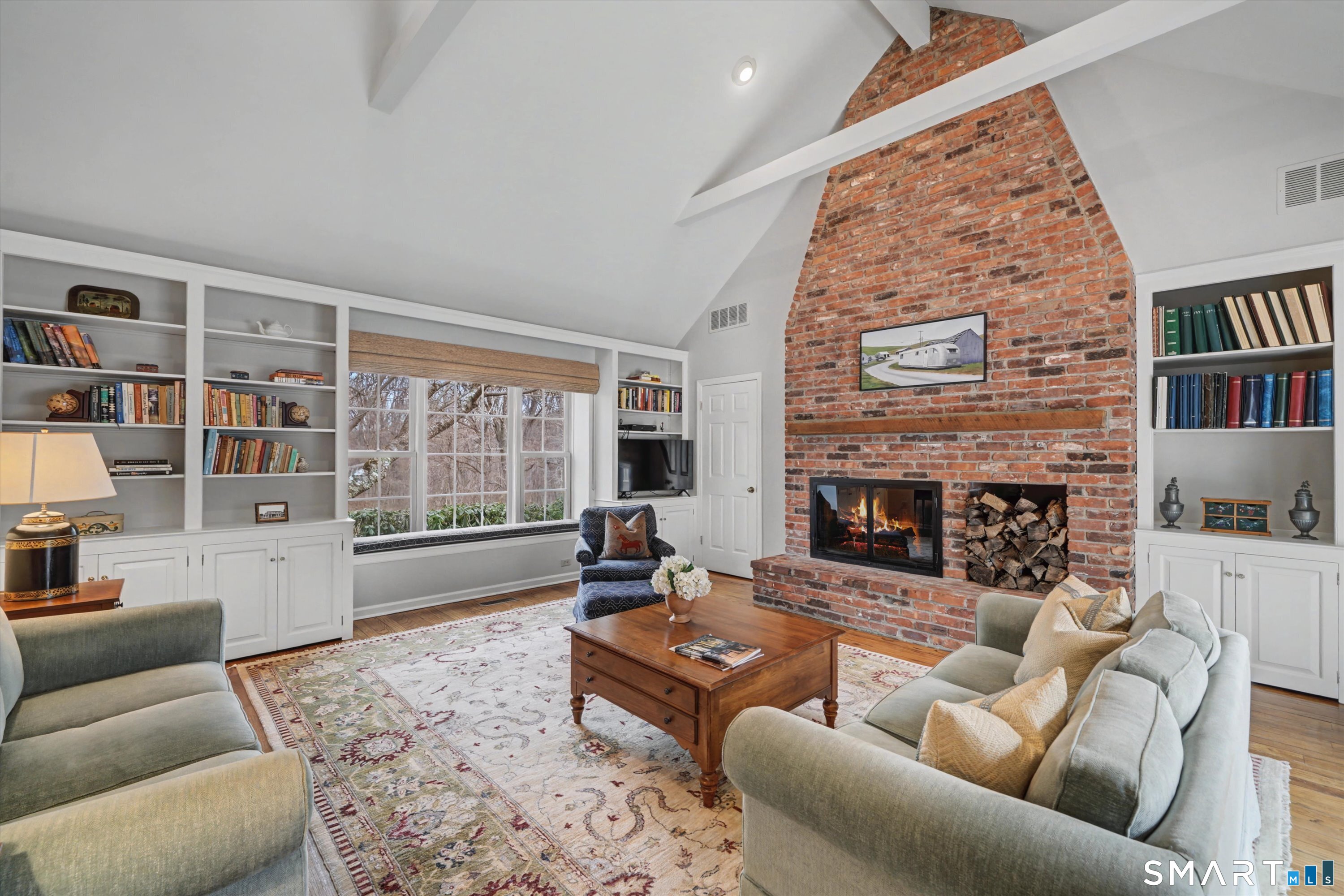 78 Keelers Ridge Road Wilton, CT 06897 - Photo 15 of 40 a living room with furniture or fireplace and a book shelf