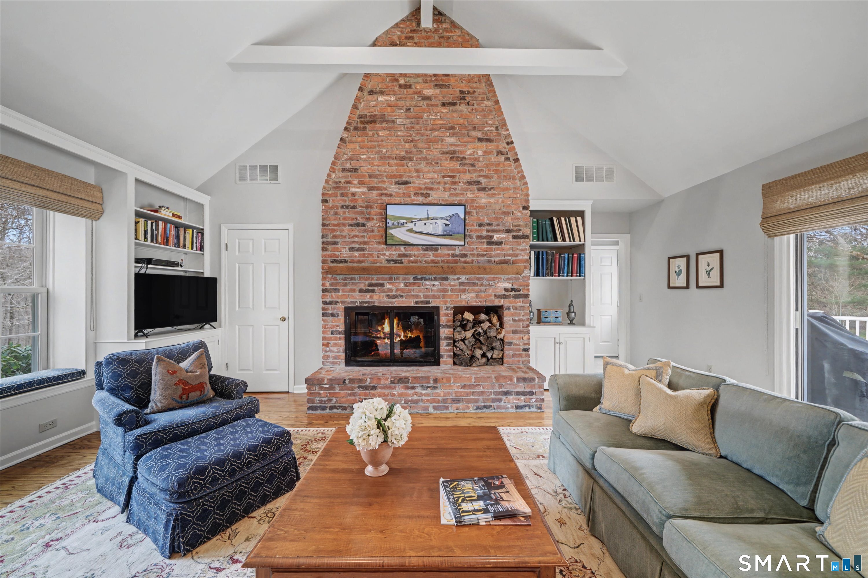 78 Keelers Ridge Road Wilton, CT 06897 - Photo 16 of 40 a living room with furniture and a fireplace