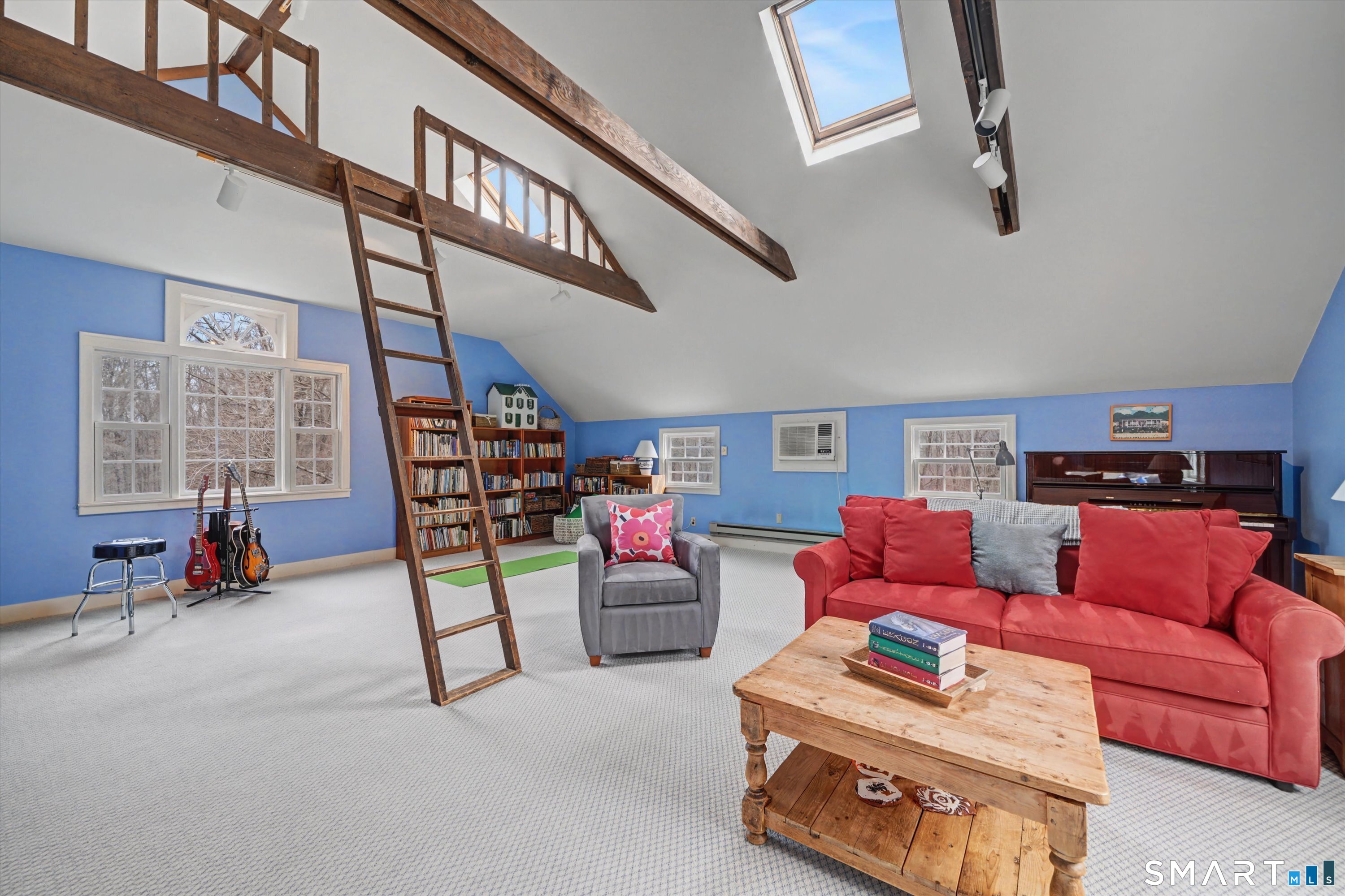 78 Keelers Ridge Road Wilton, CT 06897 - Photo 19 of 40 a living room with furniture and a book shelf