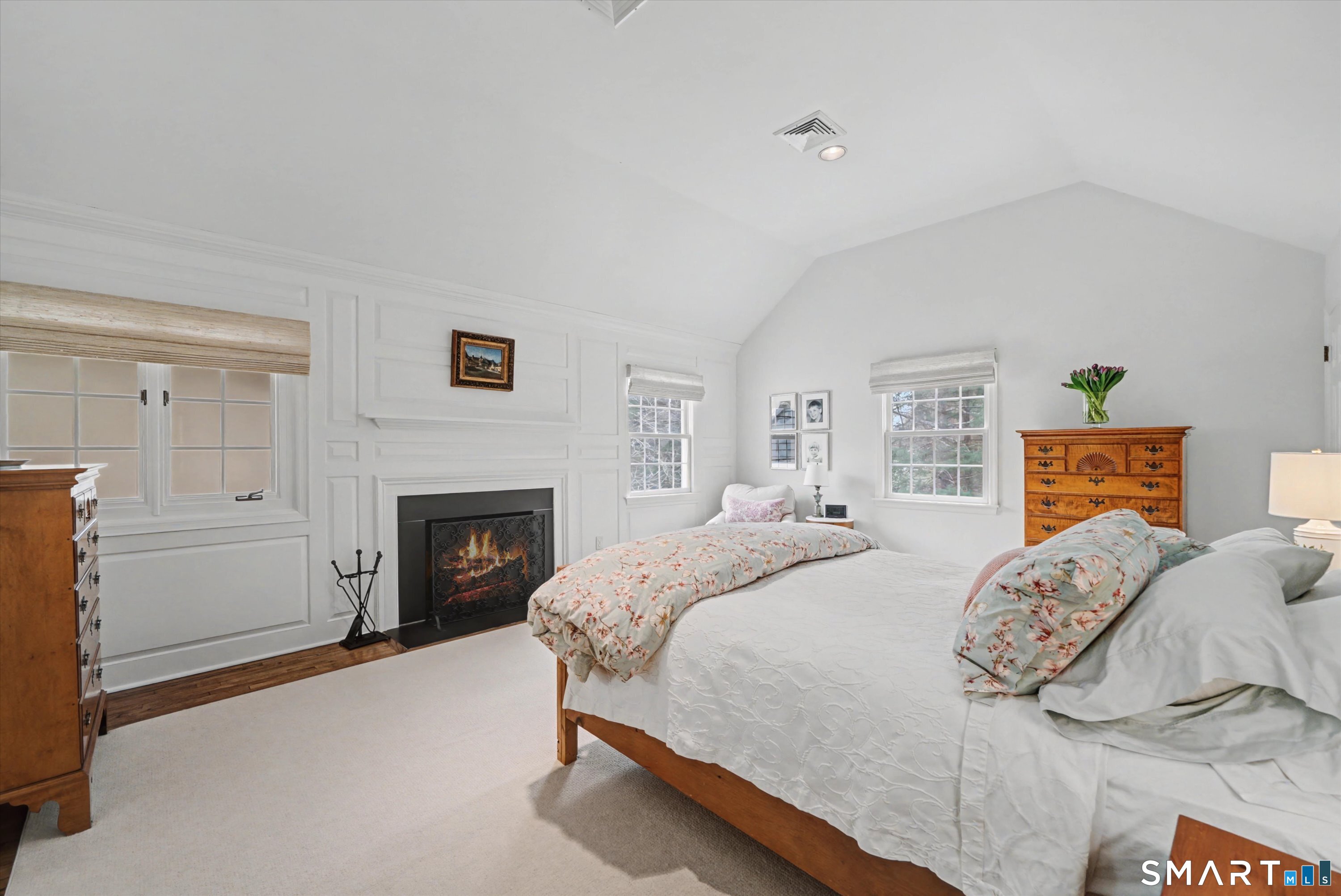 78 Keelers Ridge Road Wilton, CT 06897 - Photo 22 of 40 a bedroom with a bed and a fireplace