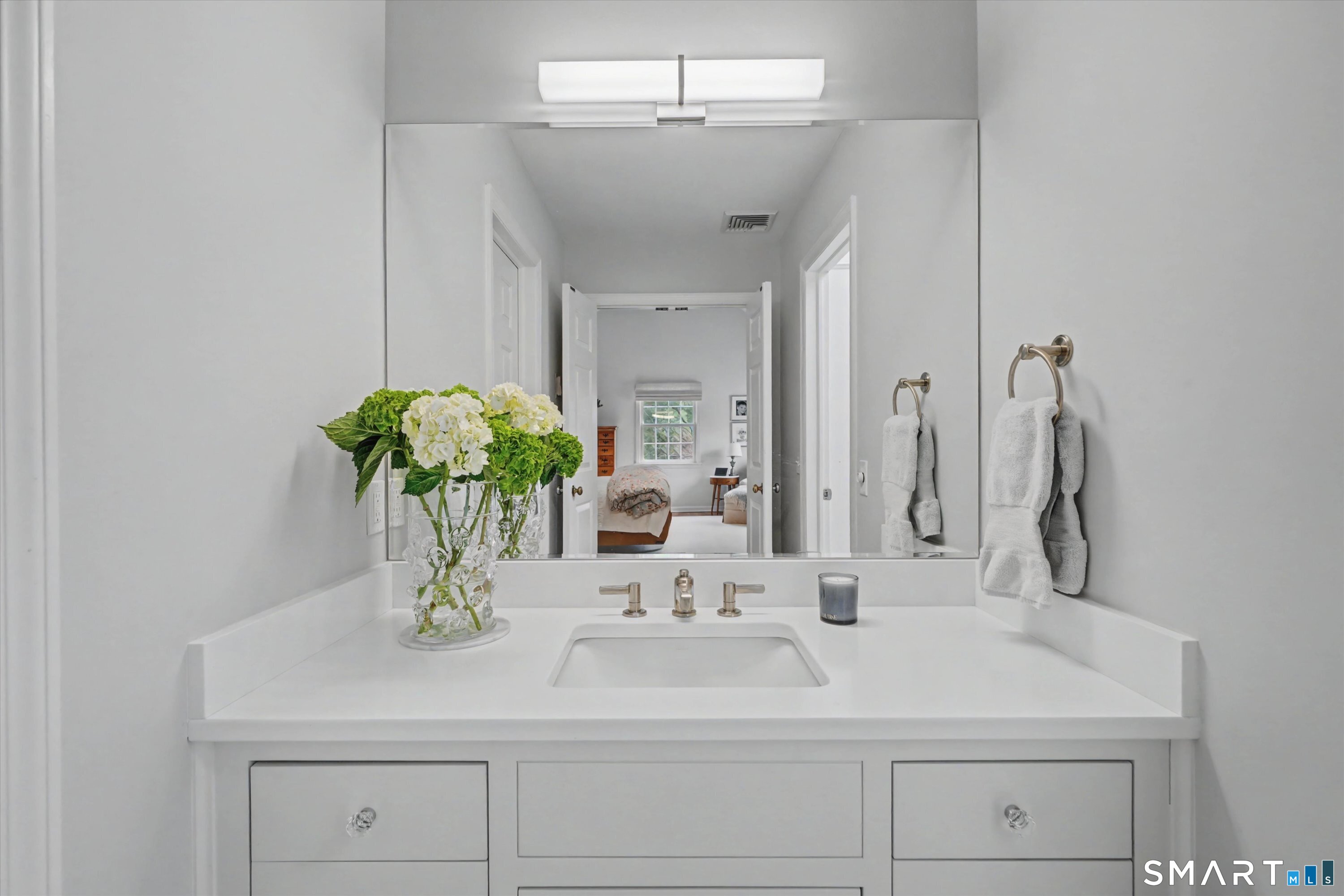 78 Keelers Ridge Road Wilton, CT 06897 - Photo 23 of 40 a bathroom with a sink a vanity and a mirror
