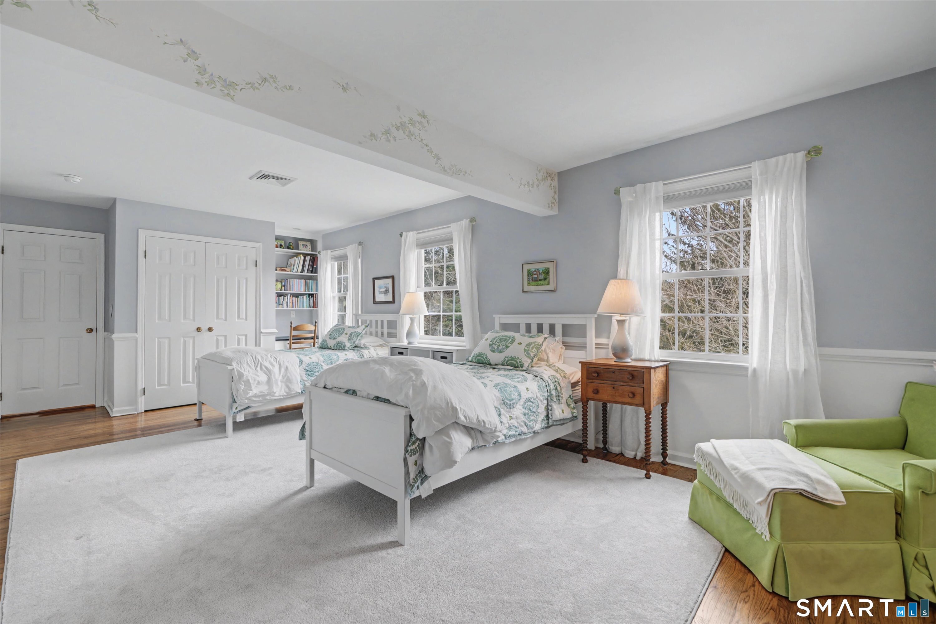 78 Keelers Ridge Road Wilton, CT 06897 - Photo 27 of 40 a spacious bedroom with a bed and a window