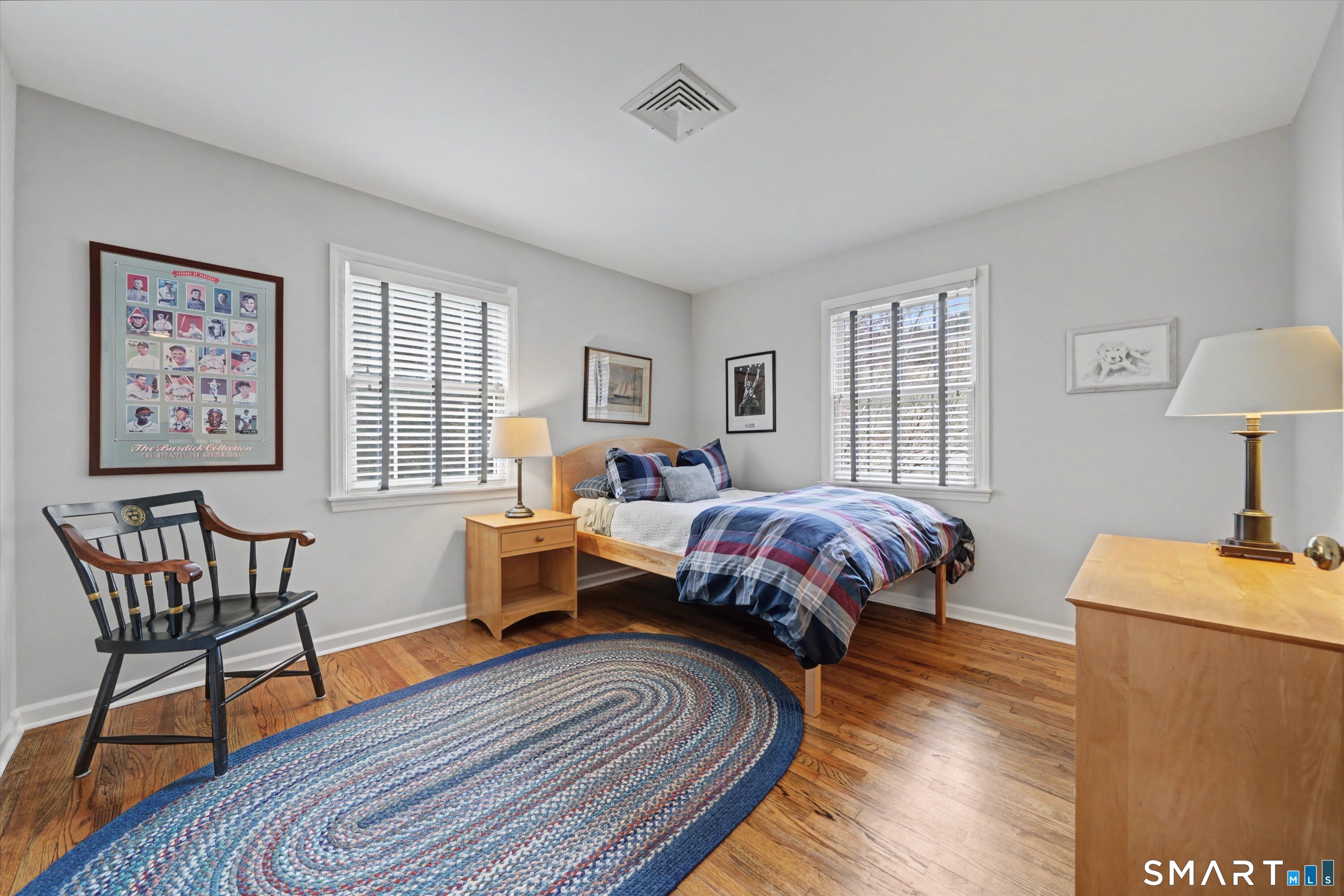 78 Keelers Ridge Road Wilton, CT 06897 - Photo 29 of 40 a spacious bedroom with a bed and wooden floor