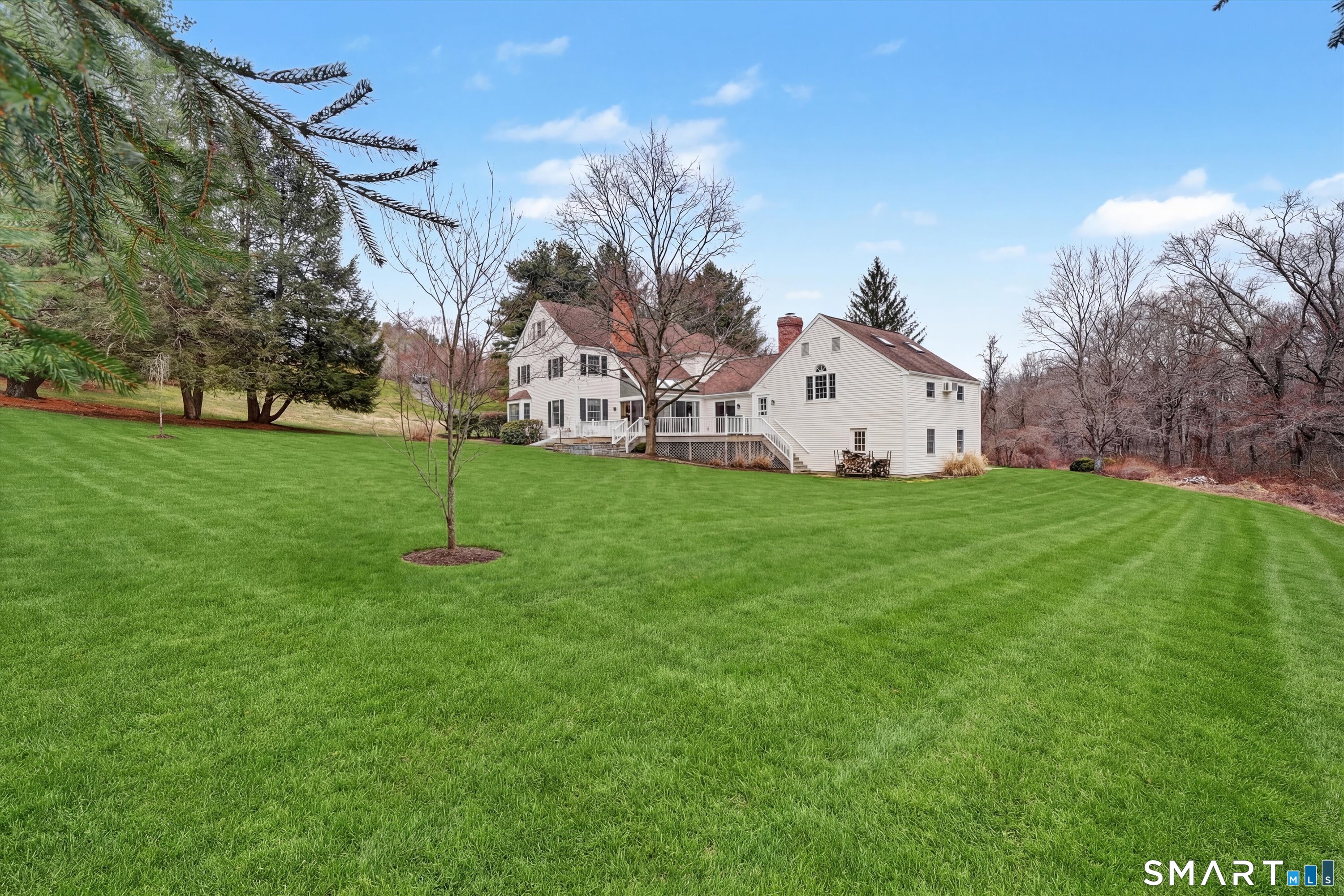 78 Keelers Ridge Road Wilton, CT 06897 - Photo 35 of 40 a view of a house with a yard and tree s