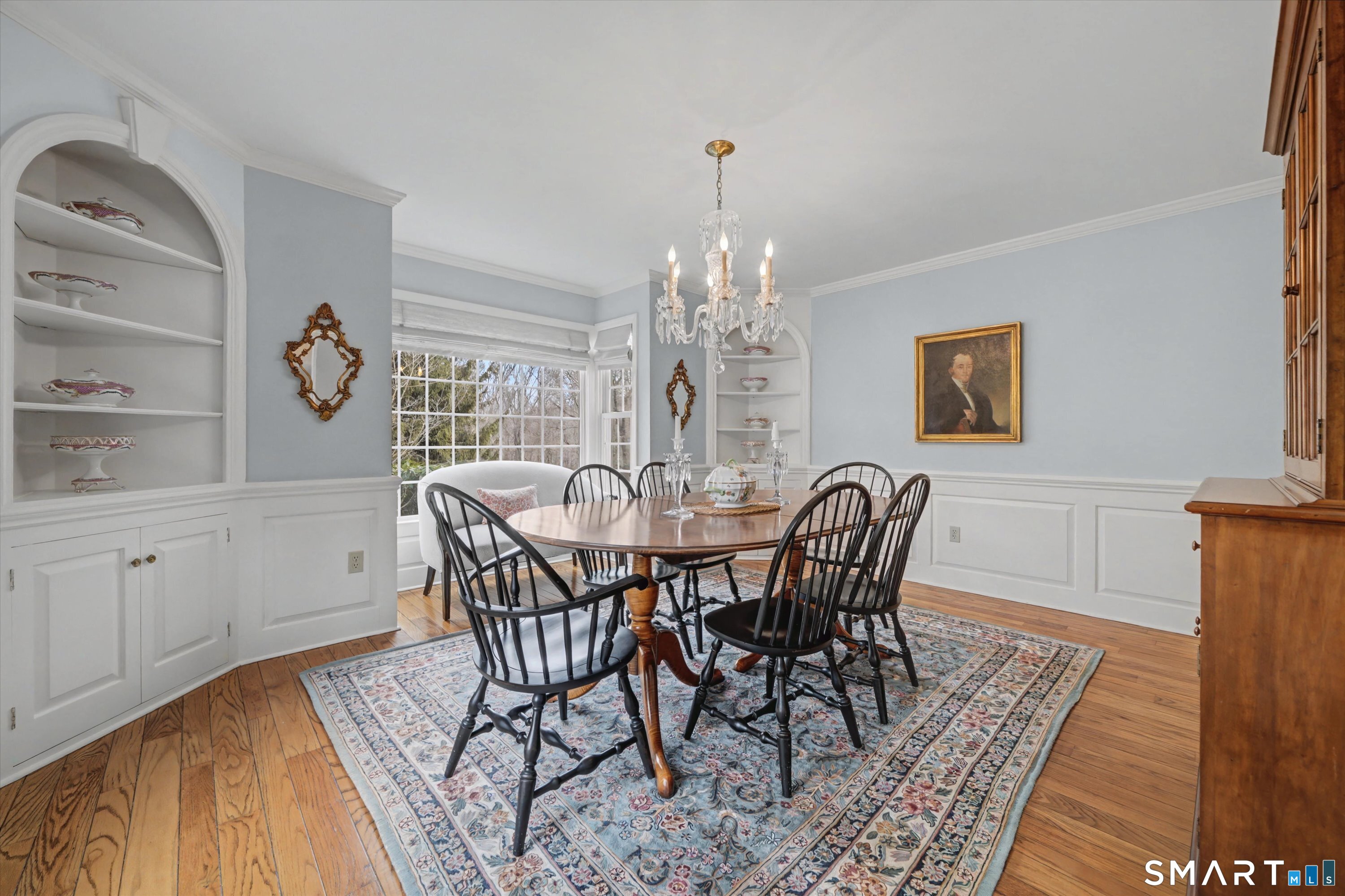 78 Keelers Ridge Road Wilton, CT 06897 - Photo 7 of 40 a view of a dining room with furniture and chandelier