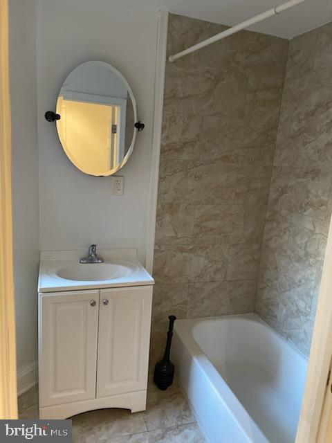 2053 South Cecil Street, Unit 1 Philadelphia, PA 19143 - Photo 7 of 13 a bathroom with a sink and a bathtub