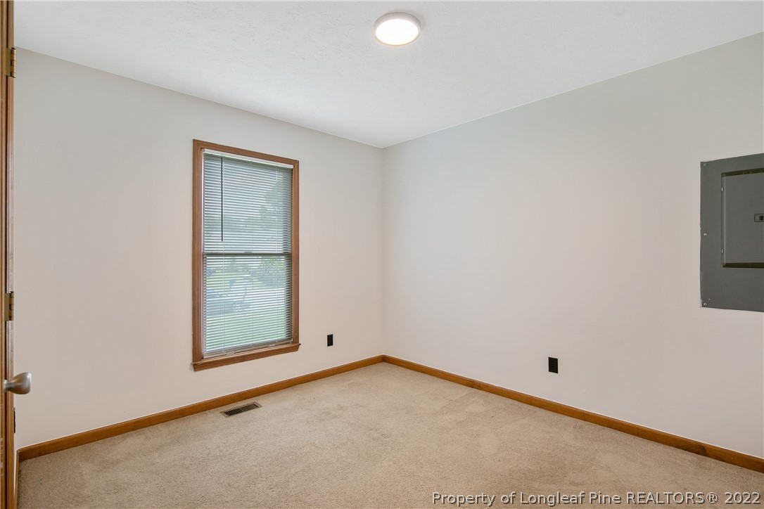 6405 Rhemish Drive Fayetteville, NC 28304 - Photo 13 of 21 an empty room with windows