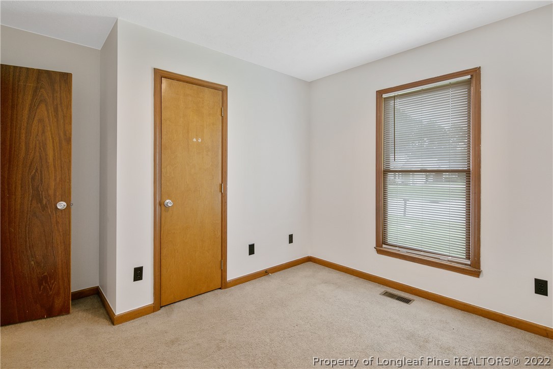 6405 Rhemish Drive Fayetteville, NC 28304 - Photo 15 of 21 a view of an empty room with window