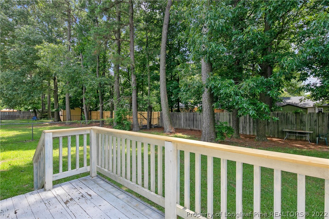 6405 Rhemish Drive Fayetteville, NC 28304 - Photo 20 of 21 a view of a wooden deck with a backyard