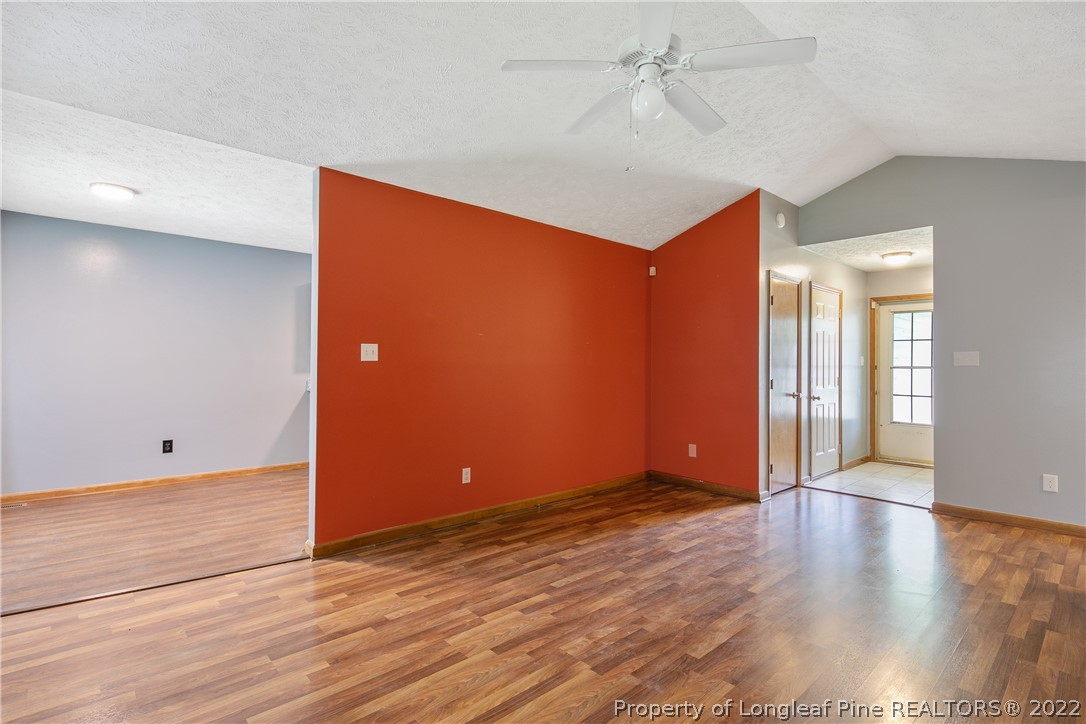 6405 Rhemish Drive Fayetteville, NC 28304 - Photo 5 of 21 wooden floor in an empty room with a window