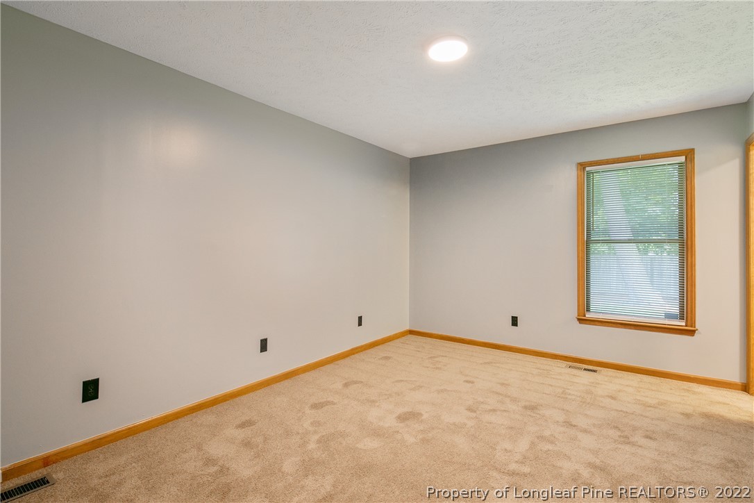 6405 Rhemish Drive Fayetteville, NC 28304 - Photo 9 of 21 an empty room with a window