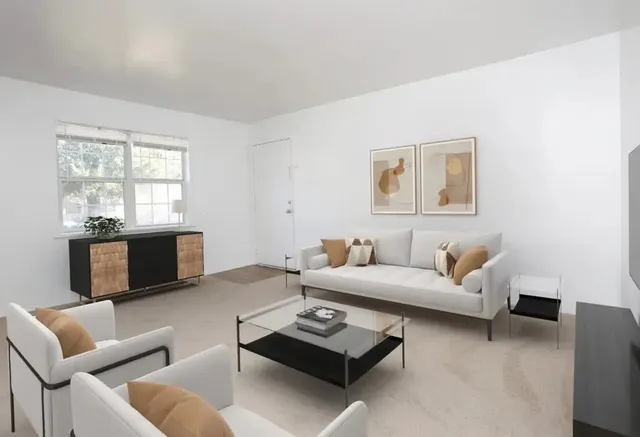 a living room with furniture and a window