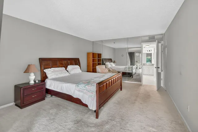 a bed room with a bed and a lamp