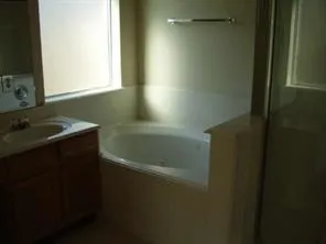 a bathroom with a sink a toilet and a bathtub
