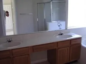 a bathroom with a sink and a mirror