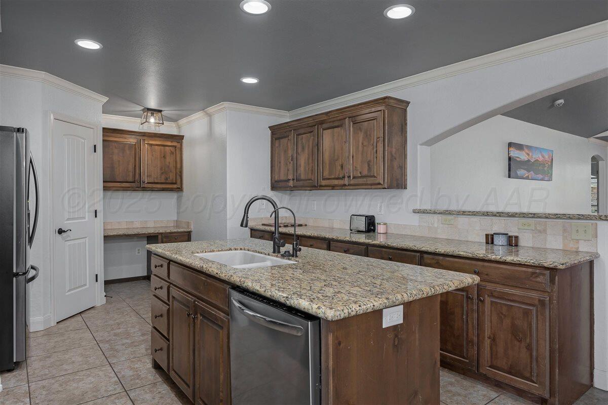 22 Sandra Lane Canyon, TX 79015 - Photo 12 of 25 a kitchen with a sink and cabinets