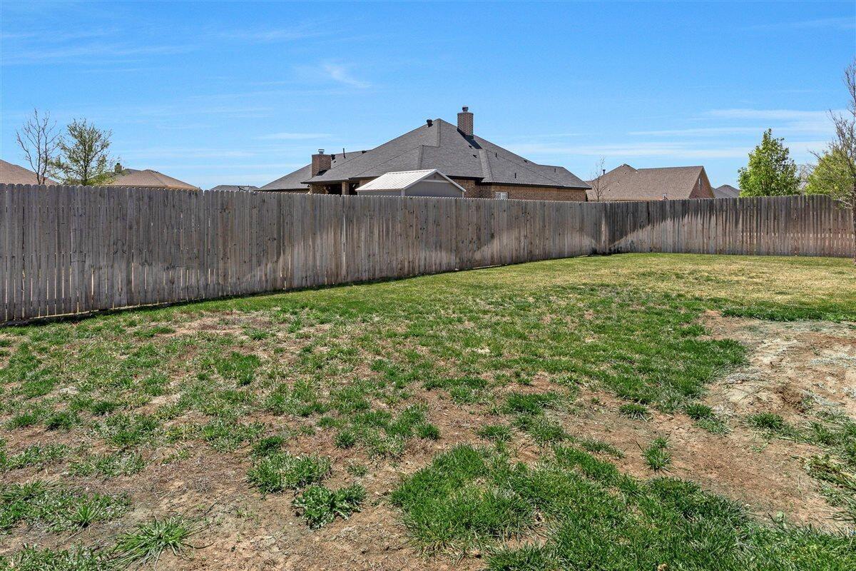 22 Sandra Lane Canyon, TX 79015 - Photo 24 of 25 a view of a backyard with wooden fence