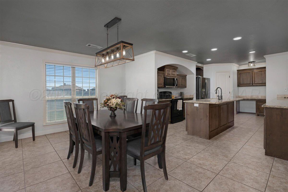 22 Sandra Lane Canyon, TX 79015 - Photo 5 of 25 a view of a dining room with furniture and wooden floor