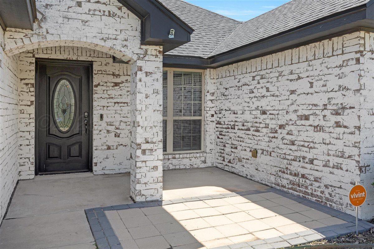 22 Sandra Lane Canyon, TX 79015 - Photo 7 of 25 a front view of a house with a brick wall