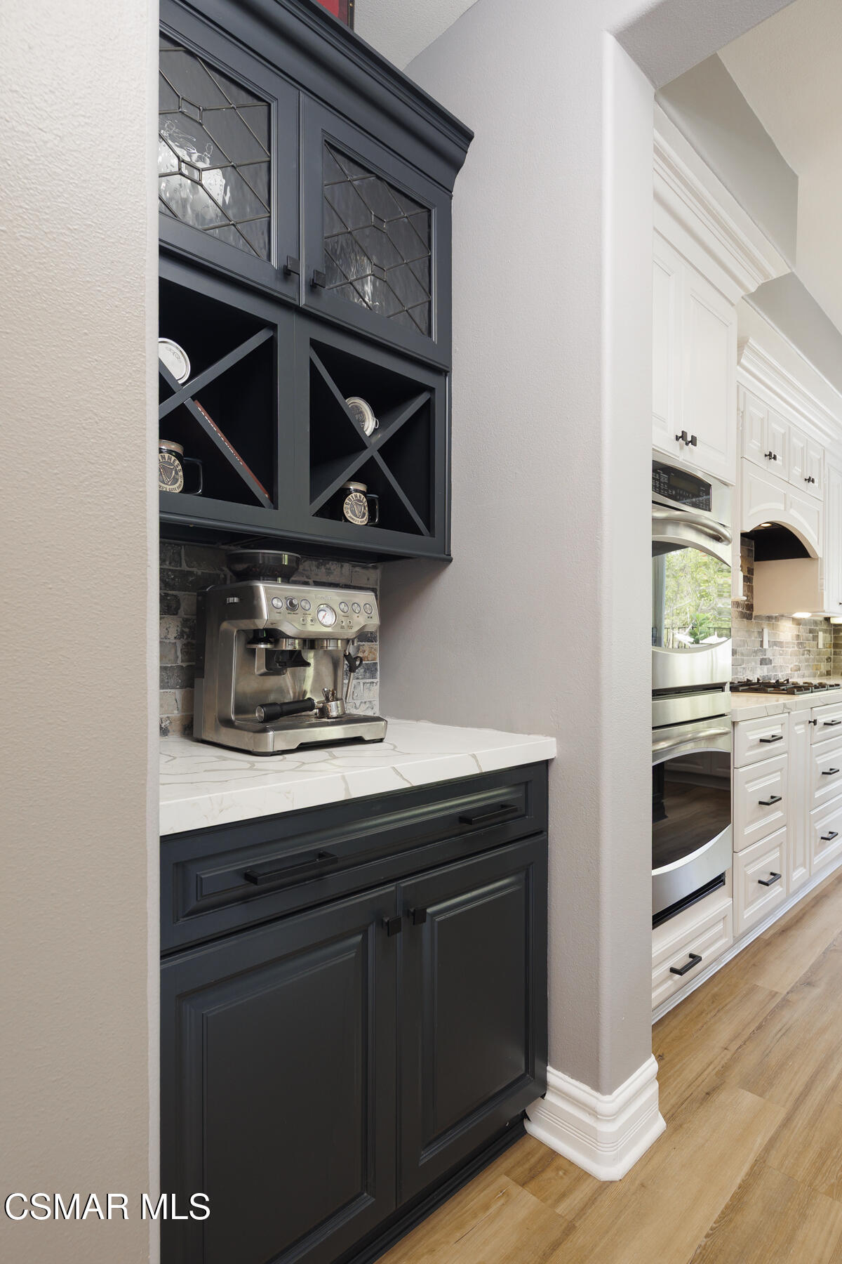 5859 Evening Sky Drive Simi Valley, CA 93063 - Photo 13 of 50 a kitchen with stainless steel appliances a stove and a microwave