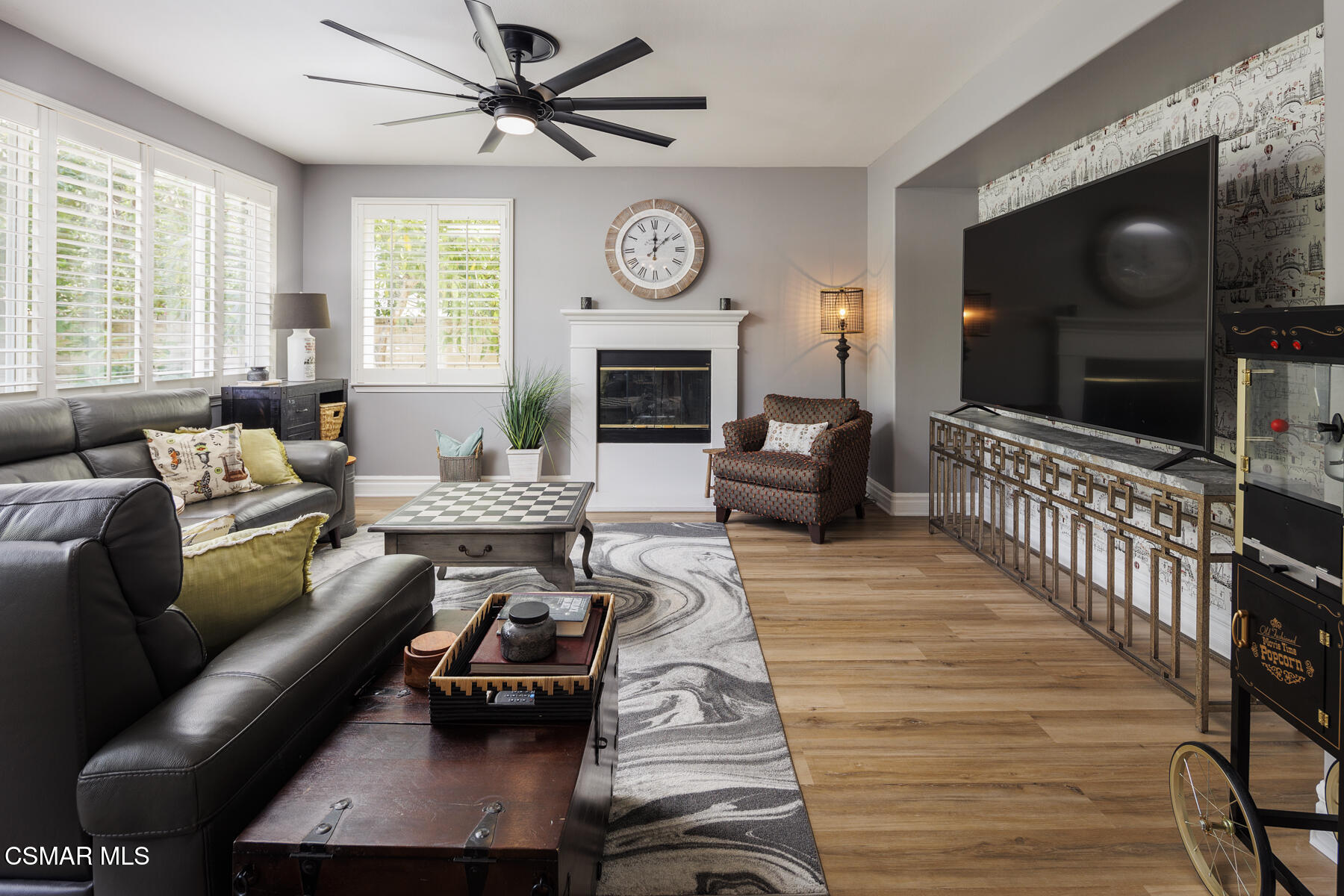 5859 Evening Sky Drive Simi Valley, CA 93063 - Photo 20 of 50 a living room with furniture a fireplace and a flat screen tv