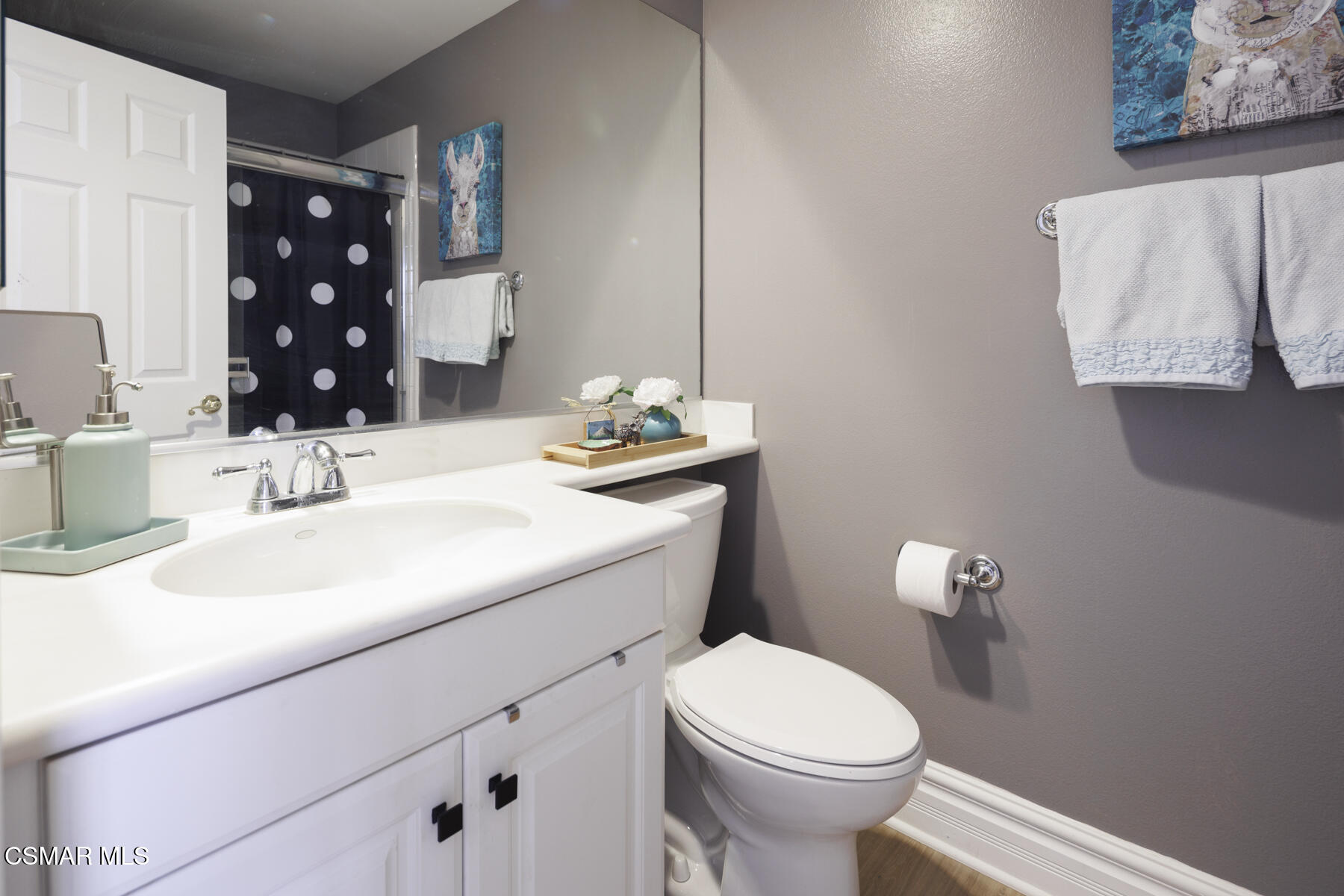 5859 Evening Sky Drive Simi Valley, CA 93063 - Photo 23 of 50 a bathroom with a sink vanity mirror and toilet
