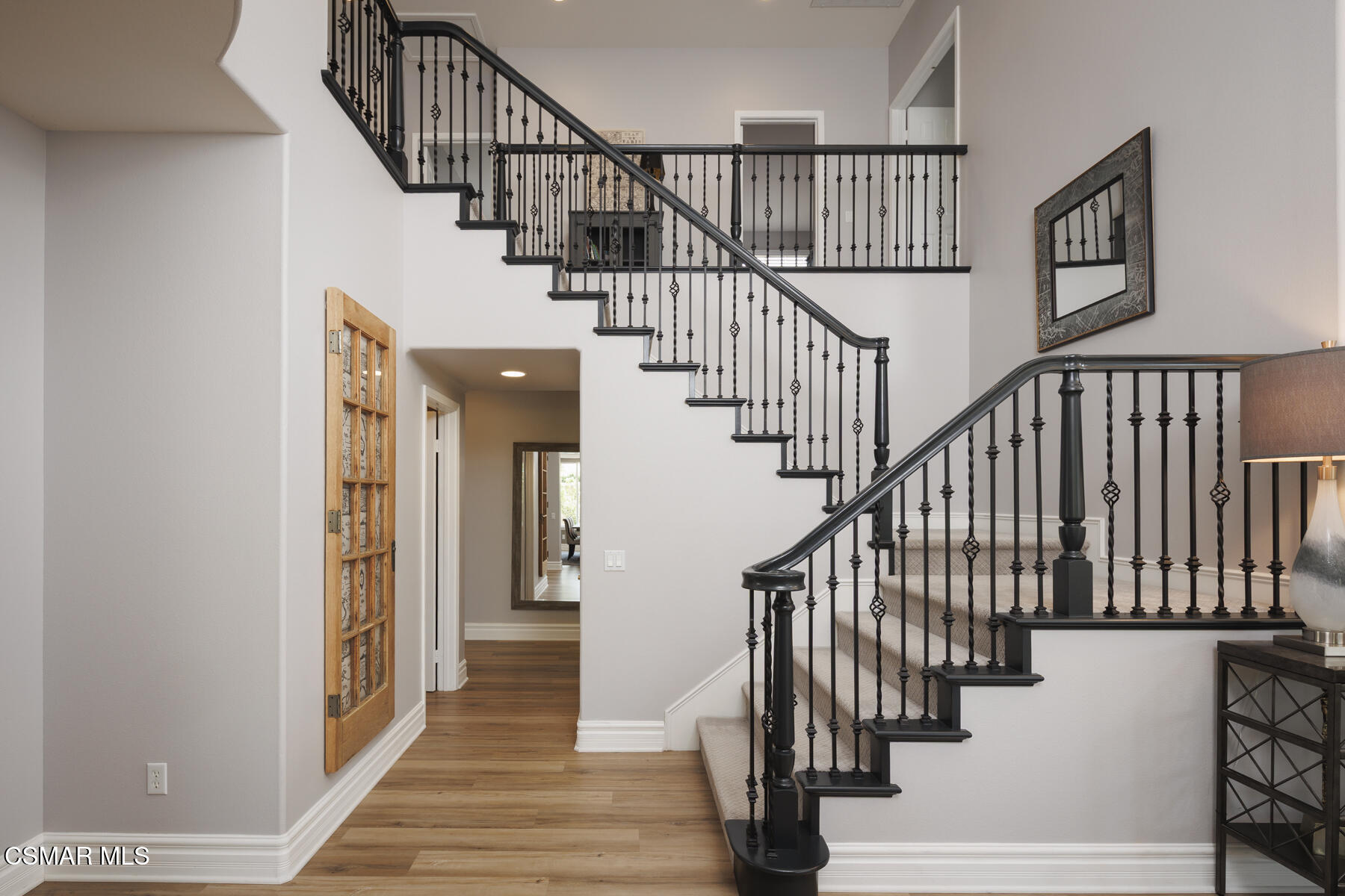 5859 Evening Sky Drive Simi Valley, CA 93063 - Photo 26 of 50 a view of staircase with lots of frames on wall and windows