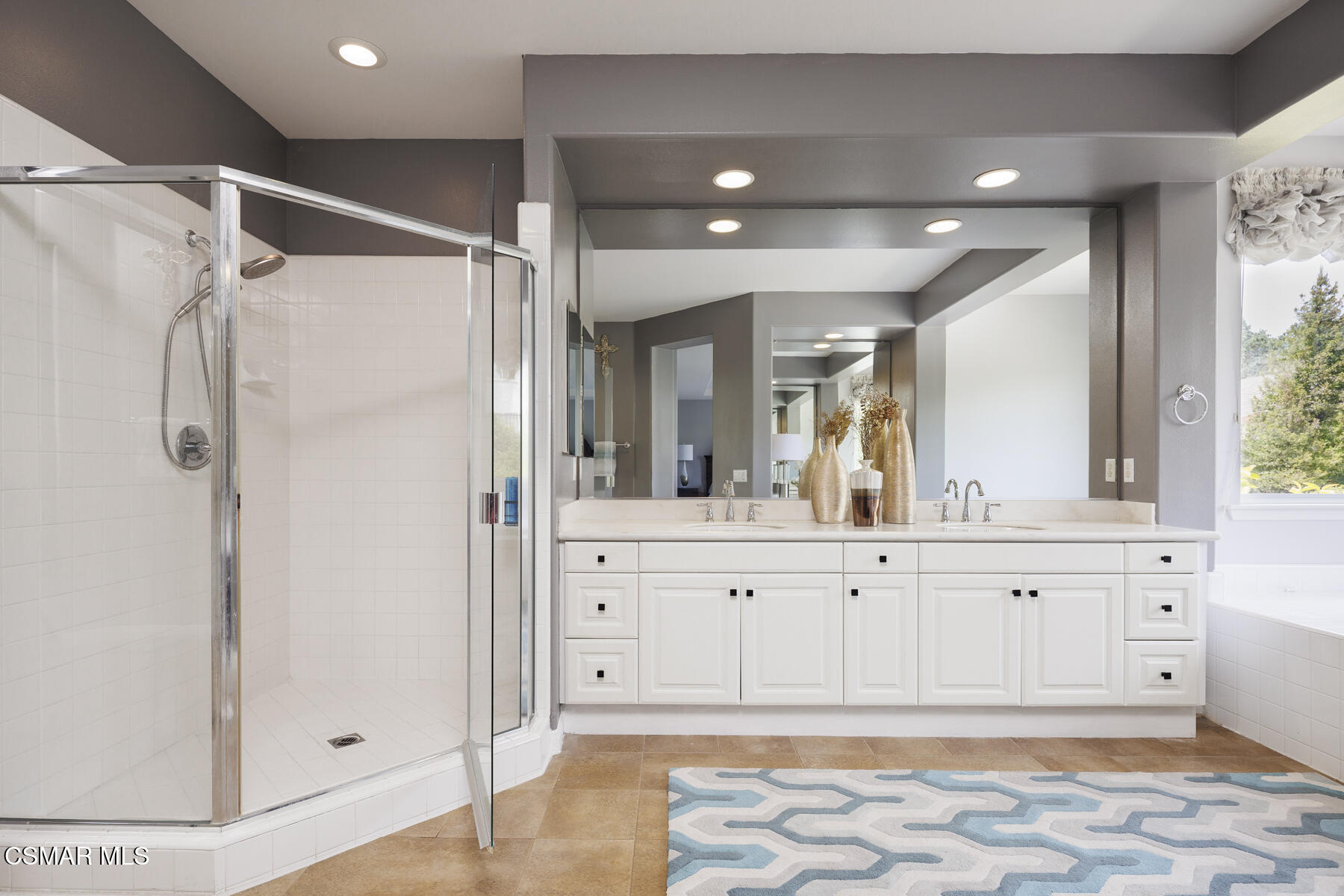 5859 Evening Sky Drive Simi Valley, CA 93063 - Photo 30 of 50 a bathroom with a mirror and a shower