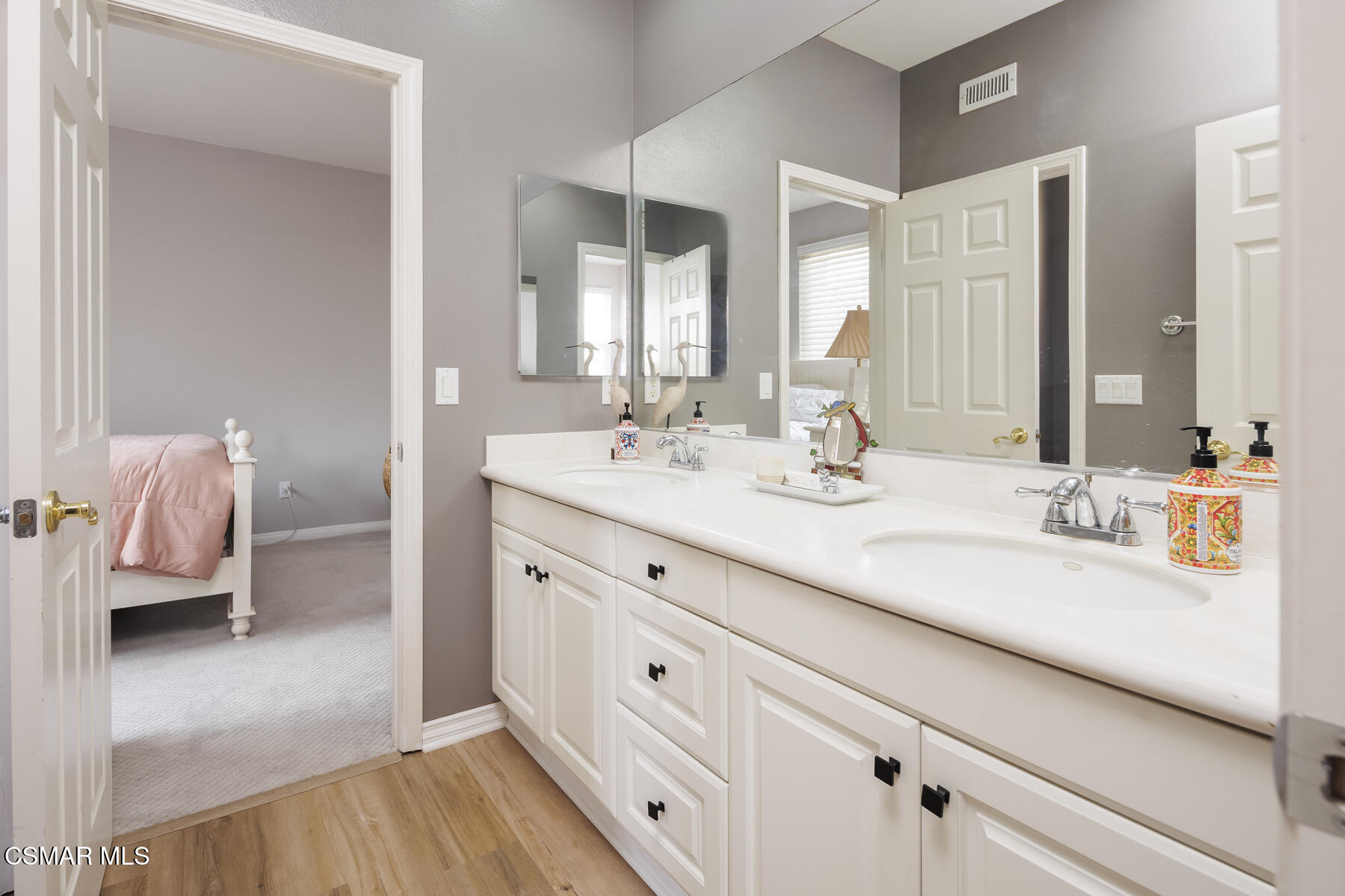 5859 Evening Sky Drive Simi Valley, CA 93063 - Photo 33 of 50 a en suite bathroom with double vanity and a mirror