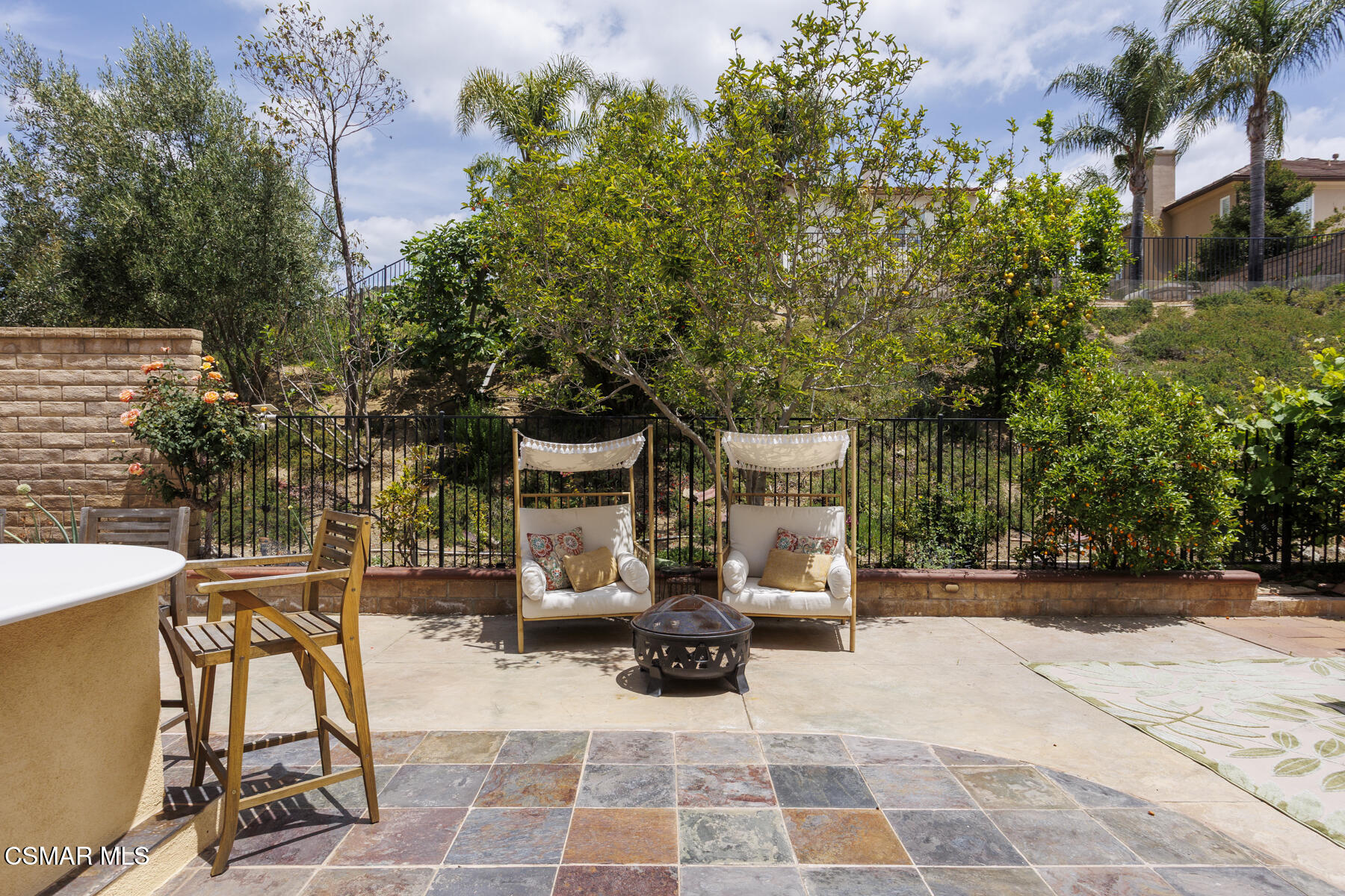 5859 Evening Sky Drive Simi Valley, CA 93063 - Photo 39 of 50 a view of a patio with table and chairs and potted plants