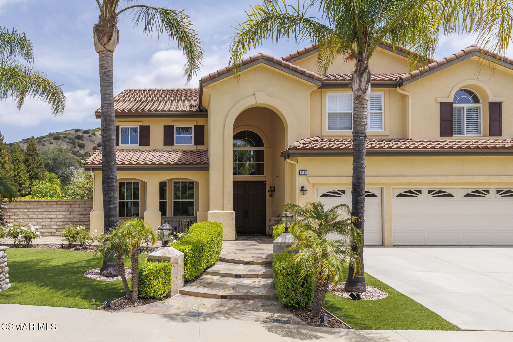 5859 Evening Sky Drive Simi Valley, CA 93063 - Photo 4 of 50 a front view of a house with a garden