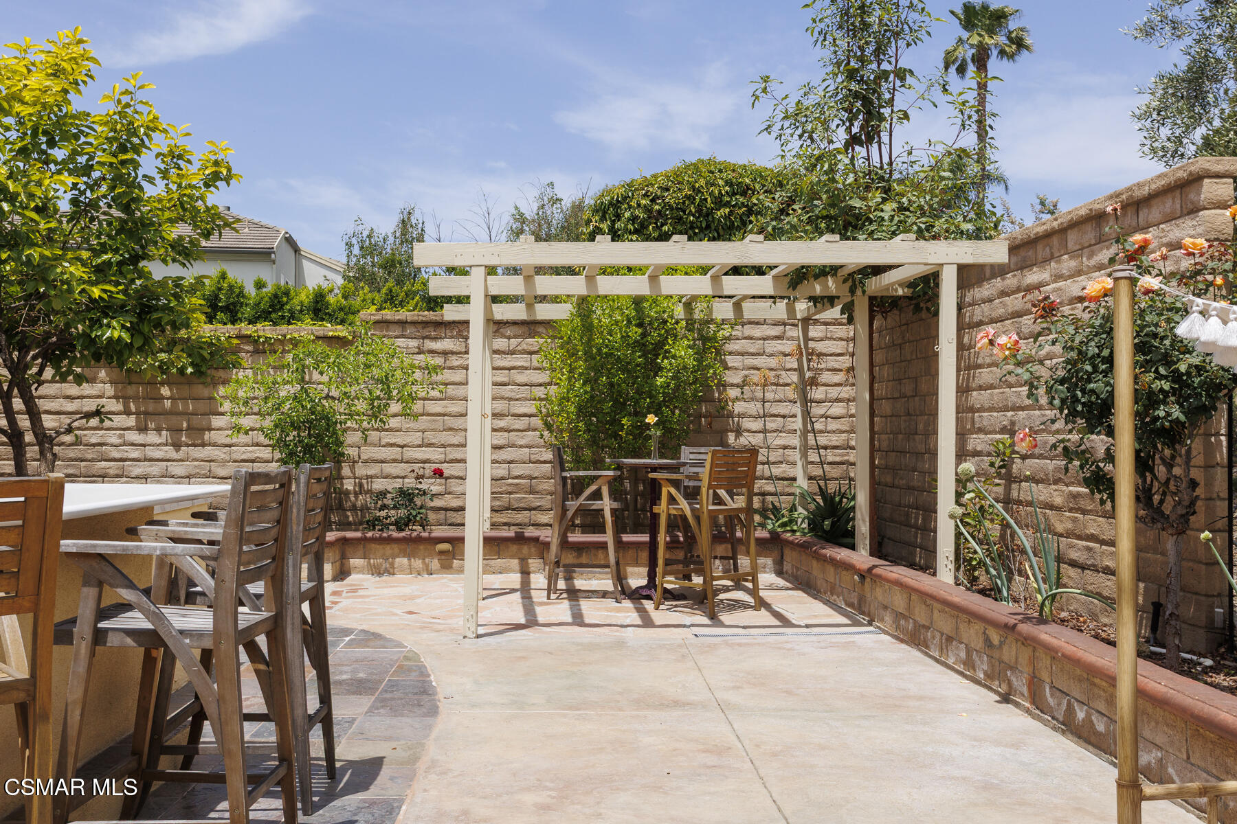 5859 Evening Sky Drive Simi Valley, CA 93063 - Photo 42 of 50 a patio with table and chairs and potted plants