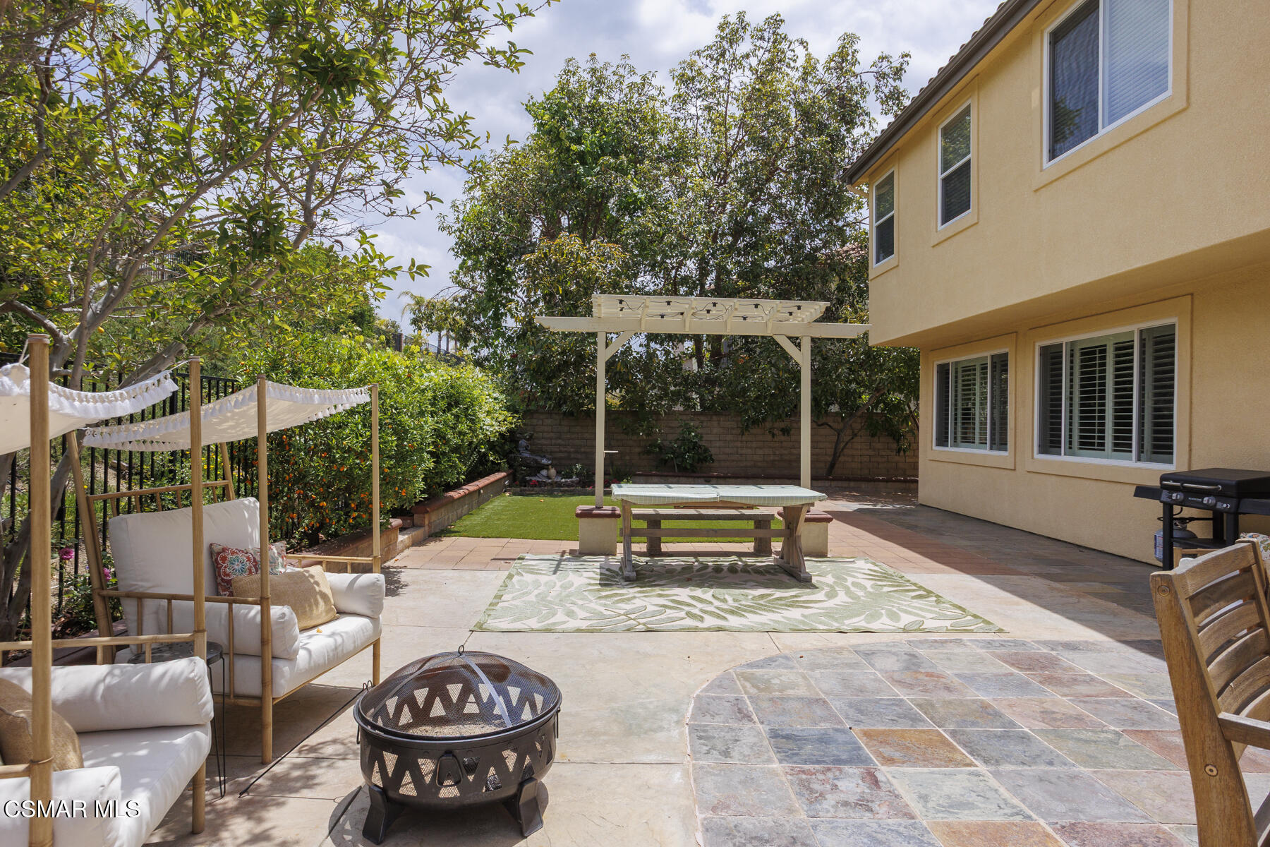 5859 Evening Sky Drive Simi Valley, CA 93063 - Photo 44 of 50 a view of a patio with couches table and chairs and potted plants