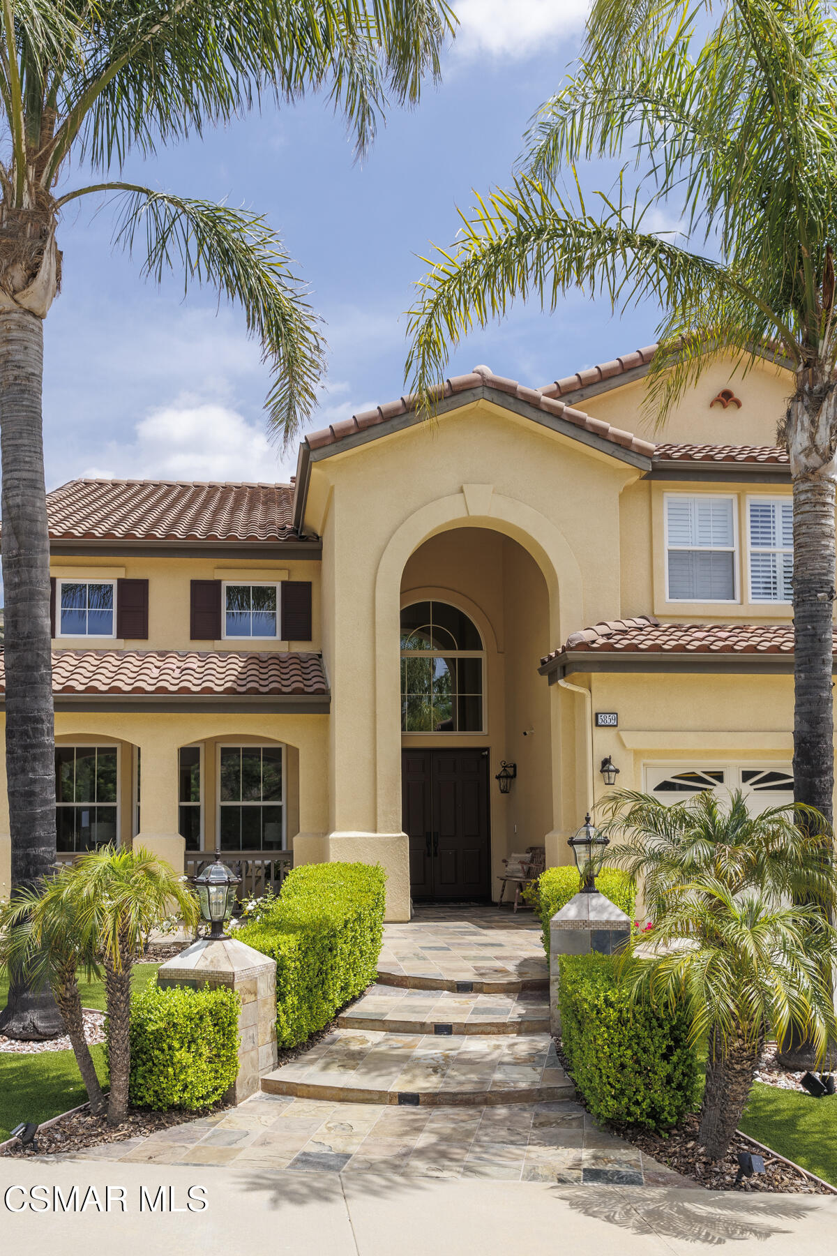 5859 Evening Sky Drive Simi Valley, CA 93063 - Photo 5 of 50 a front view of a house with a garden