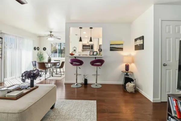 a living room with furniture and a table