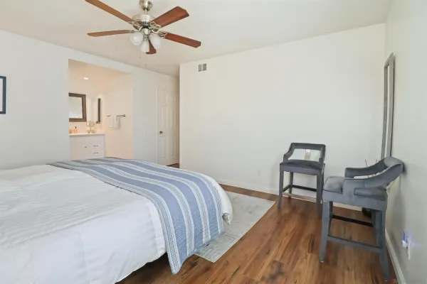 a bedroom with a bed and a table