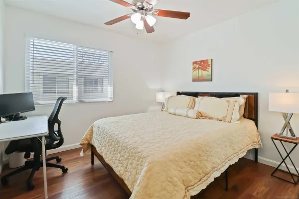a bedroom with bed and a window