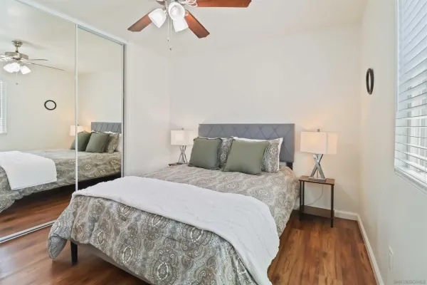 a bedroom with bed and window
