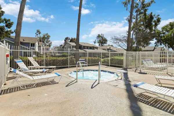 a view of a swimming pool with a lounge chair
