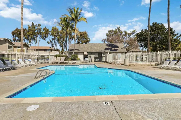 a view of a swimming pool with outdoor seating