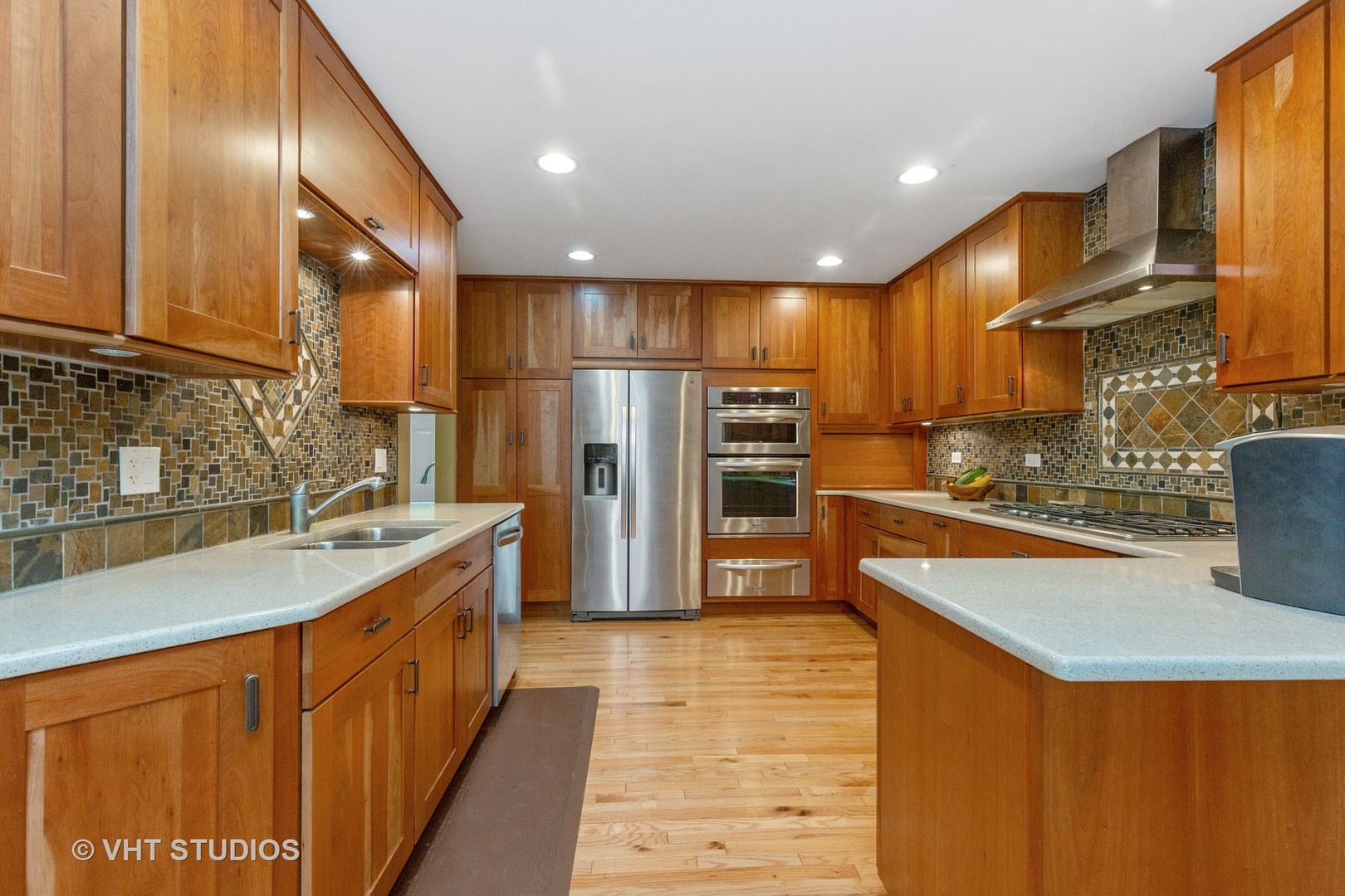 25287 Wren Road Tower Lakes, IL 60010 - Photo 11 of 51 a kitchen with stainless steel appliances granite countertop a sink stove and refrigerator