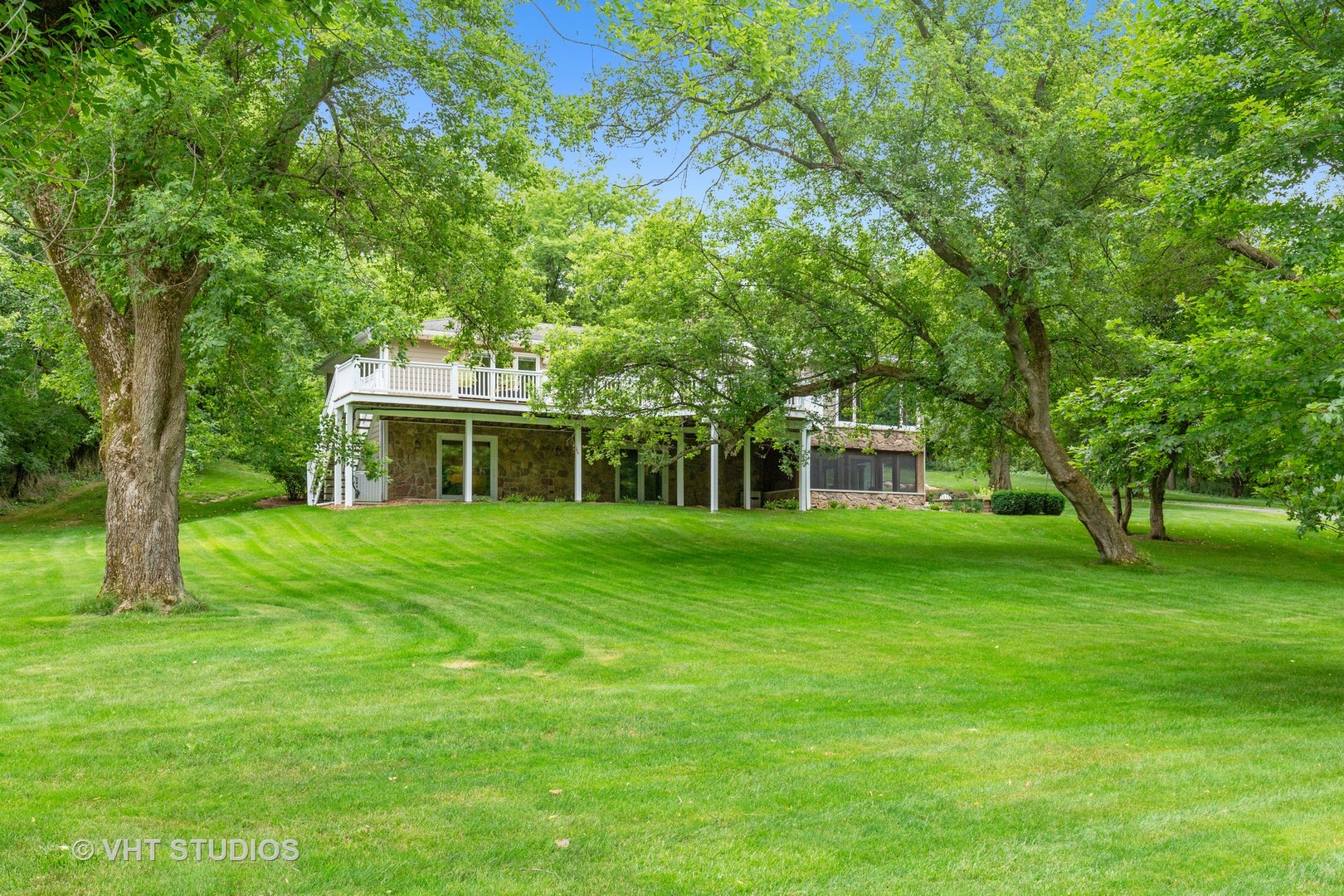 25287 Wren Road Tower Lakes, IL 60010 - Photo 36 of 51 a front view of a house with a garden
