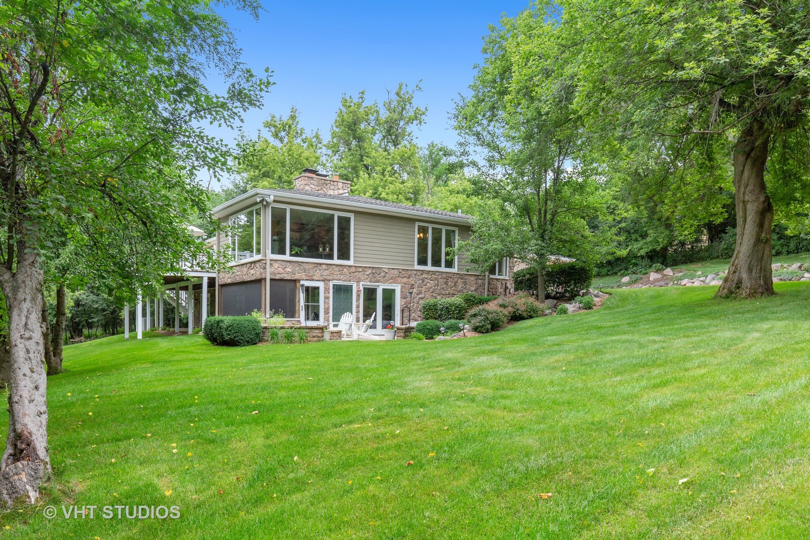 25287 Wren Road Tower Lakes, IL 60010 - Photo 37 of 51 a front view of a house with a garden