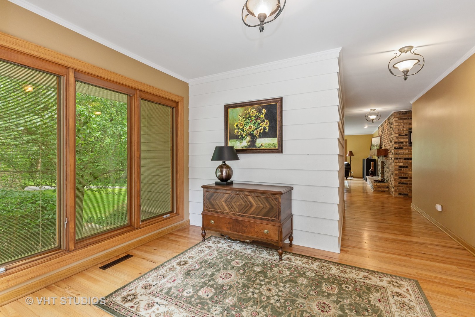 25287 Wren Road Tower Lakes, IL 60010 - Photo 5 of 51 a living room with furniture and a rug